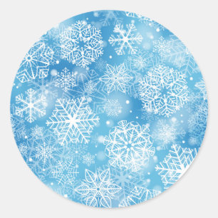 Snowflakes on blue classic round sticker