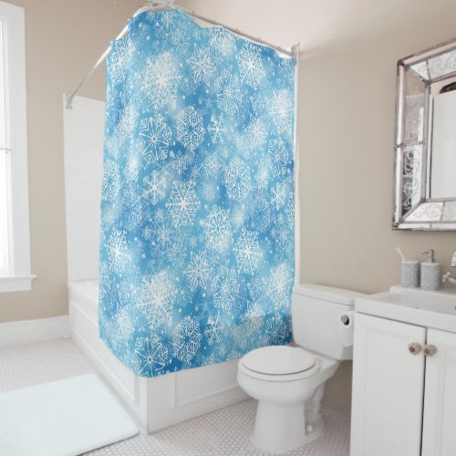 Snowflakes on blue shower curtain