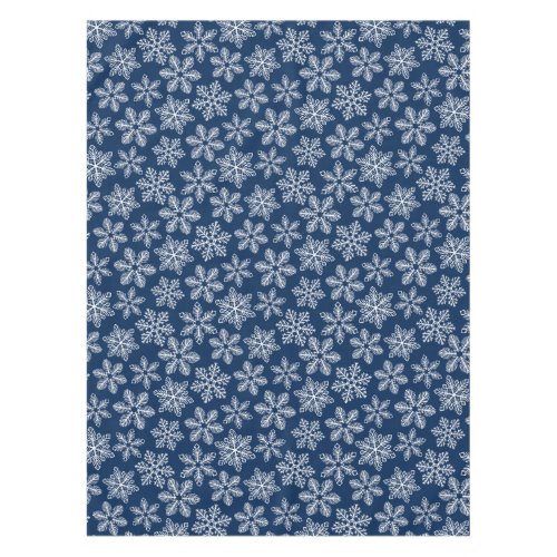 Snowflakes on dark blue tablecloth