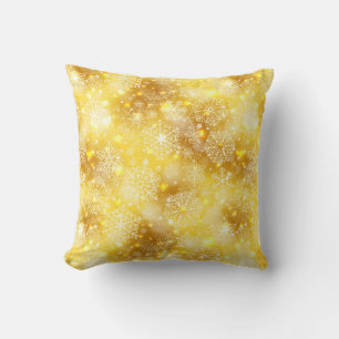 Snowflakes on golden throw pillow