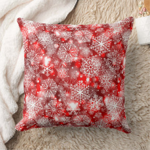 Snowflakes on red throw pillow