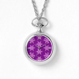 Snowflakes, pale orchid crystals on purple watch