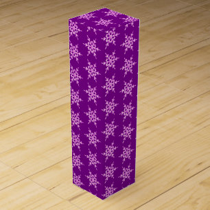 Snowflakes, pale orchid crystals on purple wine gift box