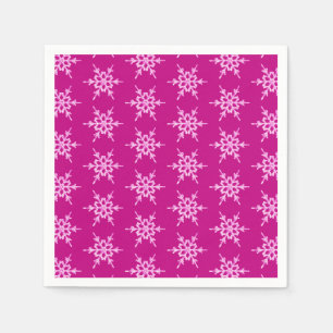 Snowflakes, pale pink crystals on magenta paper napkins