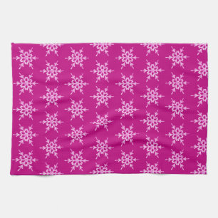 Snowflakes, pale pink crystals on magenta towel