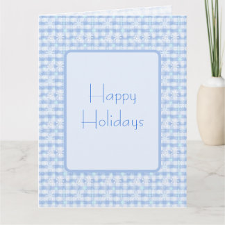 Snowflakes pattern on plaid blue background  card