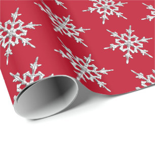 Snowflakes, silver crystals on dark red wrapping paper