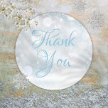 Snowflakes Winter Elegant Script Thank You Classic Round Sticker<br><div class="desc">Gentle snowflakes fall across your thank you message,  set in an elegant script text on a magical winter background. This chic thank you sticker is ideal for sealing envelopes,  party favors,  and gift wrap labels. Designed by Thisisnotme©</div>