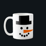 Snowman Face Winter Holiday Coffee Mug<br><div class="desc">This fun and whimsical mug has a snowman's face on a white background! Coal eyes and mouth,  a black top hat,  and an orange carrot nose that wraps around sideways will brighten your day. Perfect for winter holidays,  or all season long!</div>