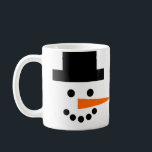 Snowman Face Winter Holiday Coffee Mug<br><div class="desc">This fun and whimsical mug has a snowman's face on a white background! Coal eyes and mouth,  a black top hat,  and an orange carrot nose that wraps around sideways will brighten your day. Perfect for winter holidays,  or all season long!</div>