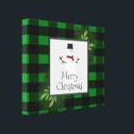 Snowman Green Buffalo Plaid Canvas Print<br><div class="desc">Make your walls festive this holiday season with a Snowman Green Buffalo Plaid Stretched Canvas Print.  Canvas print design features a box adorned with pine branches and charming snowman against a buffalo plaid background.  Additional gift and holiday items available with this design as well.</div>