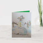 snowman greeting card<br><div class="desc">An original watercolor with a snowman,  flower crowns and chickadees printed on the front of this greeting card,  inside the background color is green.  A great card to cheer someone,  or just to say hello.  Also could be nice for Christmas.  painting by Kristina Anderson</div>