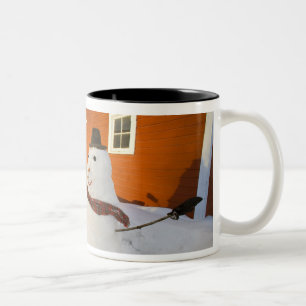 Snowman in front of red barn in Columbia Falls Two-Tone Coffee Mug