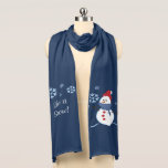 Snowman Let it Snow Scarf<br><div class="desc">This pretty winter scarf features a cute cartoon snowman image. The snowman is wrapped up in a blue scarf, and wears a bright red hat which matches his red buttons. There are various sized snowflakes falling round about him. The other side of the scarf has snowflakes falling around the text...</div>