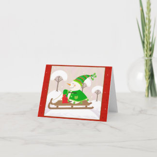 Snowman on a sled holiday card