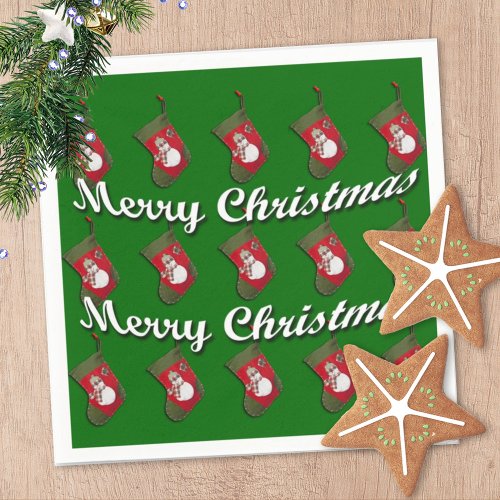 Snowman on Christmas Stocking Over Green Paper Napkins