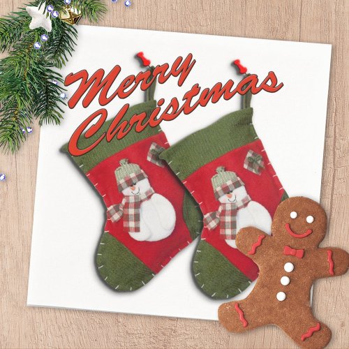 Snowman on Christmas Stocking Over White Paper Napkins