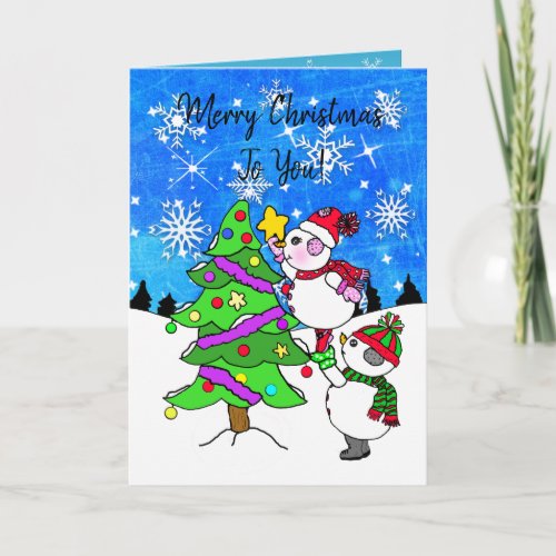 Snowman putting star on Christmas Tree Card