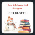 Snowman This Christmas Book Belongs To Custom Name Square Sticker<br><div class="desc">Inspire the wonder of reading this Christmas, with this charming bookplate sticker. The words are 'This Christmas book belongs to' in red script typography, followed by the recipient's name (click 'Personalize' to enter the name you would like). The festive sticker is decorated with a watercolor-style picture of a snowman with...</div>
