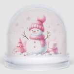 Snowman's Pink Christmas Dream Snow Globe<br><div class="desc">Inside this whimsical festive snow globe, is a 'sweet as can be' snowman, with outstretched twig arms and fluffy body. Pink accessories and a soft pink background filled with sweet pink marshmallows and a little Christmas tree. A display of winter delight. It’s not just a snow globe it’s a celebration...</div>