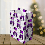 Snowmen in Purple Velvet Elegant Christmas Medium Gift Bag<br><div class="desc">Introducing our "Snowmen in Purple Velvet Elegant Christmas" gift bag – the perfect way to add a touch of enchantment to your holiday gifting! This charming gift bag features a delightful design that captures the essence of a winter wonderland. In beautiful shades of purple and white, the bag exudes a...</div>