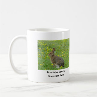 Snowshoe hare adores dandelions coffee mug