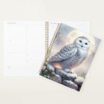 Snowy Owl in Moonlit Winter Garden Planner<br><div class="desc">A majestic snowy owl perches gracefully on a frost-covered stone wall, illuminated by the soft glow of a full moon. Surrounded by delicate pink and white roses dusted with snow, this enchanting scene evokes a sense of quiet wonder and mystical beauty. The artwork blends elements of winter fantasy art and...</div>