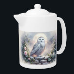 Snowy Owl in Moonlit Winter Garden Teapot<br><div class="desc">A majestic snowy owl perches gracefully on a frost-covered stone wall, illuminated by the soft glow of a full moon. Surrounded by delicate pink and white roses dusted with snow, this enchanting scene evokes a sense of quiet wonder and mystical beauty. The artwork blends elements of winter fantasy art and...</div>