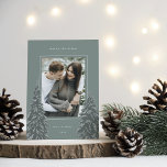 Snowy Pine | Elegant Christmas Photo Holiday Card<br><div class="desc">A modern and elegant Christmas holiday card design featuring a single vertical photo on a sage green background. Two tall pine trees frame your photo,  dotted with white snow. Personalize with your custom holiday greeting,  family name and the year.</div>