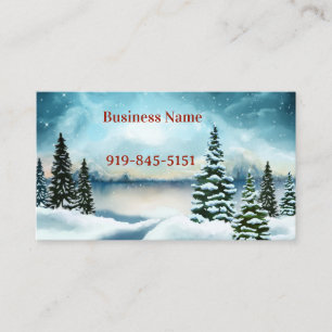 Snowy pine trees near a lake business card