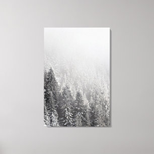 Snowy spruce forest wrapped in fog canvas print