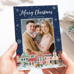 Snowy Winter Village Merry Christmas 2 Photo Holiday Card<br><div class="desc">Send wintry holiday greetings to family and friends with a Snowy Winter Village Christmas photo card by Late Bloom Paperie! The festive holiday card displays "Merry Christmas" at the top in a bold white script. The bottom of the card features a snowy winter town decorated by Christmas lights, holiday wreaths,...</div>