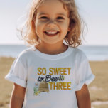 So Sweet to Bee Three 3rd Birthday Toddler T-shirt<br><div class="desc">Personalized 3rd birthday t-shirt with "So sweet to bee three" on the front and "Happ-Bee birthday [name]" on the back. The bee themed design features fun bee puns in yellow and black lettering, decorated with bumblebees, a beehive, country flowers and dripping honey. For co-ordinating invitations and party decor, please browse...</div>