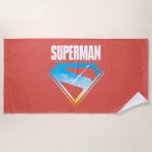 Soaring Through the S-Shield Beach Towel<br><div class="desc">Unleash the heroic energy of the Man of Steel with this bold and inspiring design! A silhouette of Superman rockets skyward, leaving a brilliant trail through a vibrant sky, all framed within his iconic “S” emblem. The deep red backdrop contrasts beautifully with the sky blue and golden hues peeking through...</div>