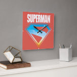 Soaring Through the S-Shield Square Wall Clock<br><div class="desc">Unleash the heroic energy of the Man of Steel with this bold and inspiring design! A silhouette of Superman rockets skyward, leaving a brilliant trail through a vibrant sky, all framed within his iconic “S” emblem. The deep red backdrop contrasts beautifully with the sky blue and golden hues peeking through...</div>