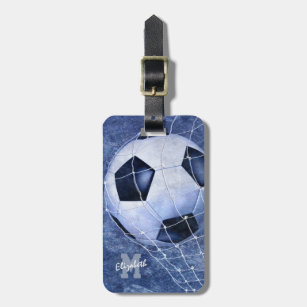 Soccer ball denting the net blue girl's soccer luggage tag