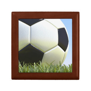Soccer ball on grass. gift box