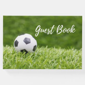 Soccer ball on green grass  guest book