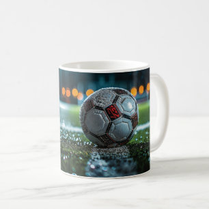 Soccer ball on the empty wet arena pitch coffee mug