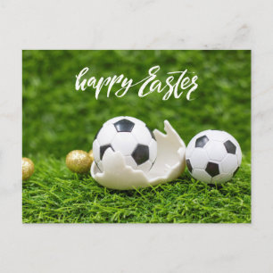 Soccer ball with Eggs Easter on green grass Postcard