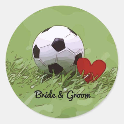 Soccer ball with red heart on green grass wedding  classic round sticker