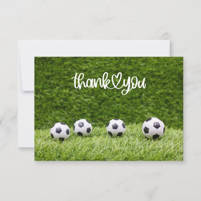Soccer balls are on green grass thank you card (Front)