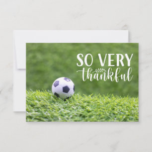 Soccer balls are on green grass thank you card