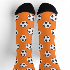 Soccer balls on orange socks