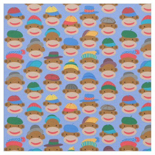 Sock Monkey Heads with caps on Blue Fabric