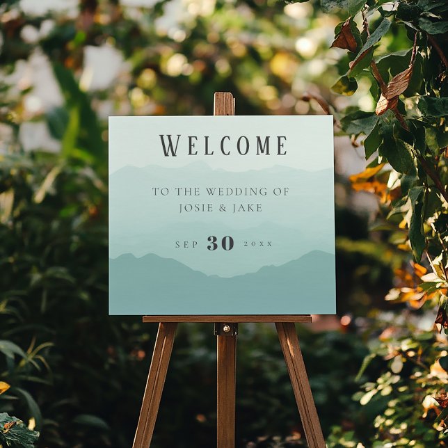 Soft green mountains wedding welcome sign (Soft calming green mountains wedding welcome sign adding a touch of natural elegance.)