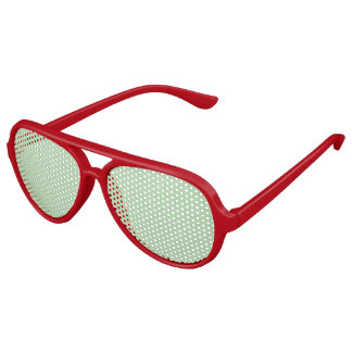Soft mint-green background fills the image aviator sunglasses