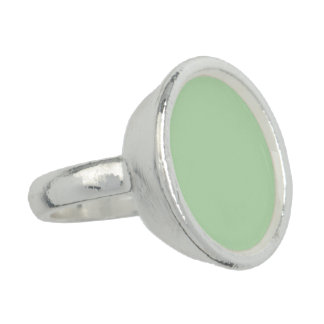 Soft pale green background with subtle vertical ring