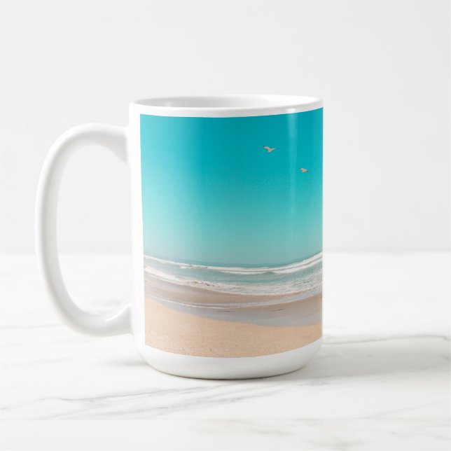 Soft Pastel Ocean Sandy Beach Sky Flying Seagulls Coffee Mug (Left)