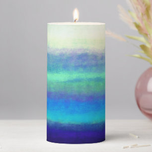 Soft shades of blue and green pillar candle